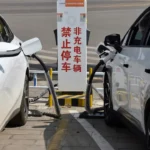 photograph of EV cars charging batteries at a charging station