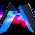 Concept image of two foldable OLED smartphone displays facing each other against a colourful neon background.
