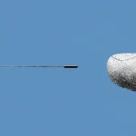 illustration of an AI-powered six-axis force sensor developed by Chinese researchers set next to a finger to show is miniature size