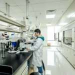 photograph shows a researcher working in an InnoCare Pharma lab