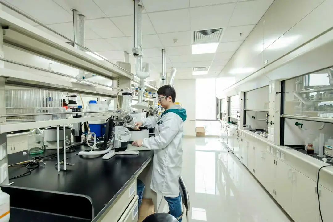 photograph shows a researcher working in an InnoCare Pharma lab