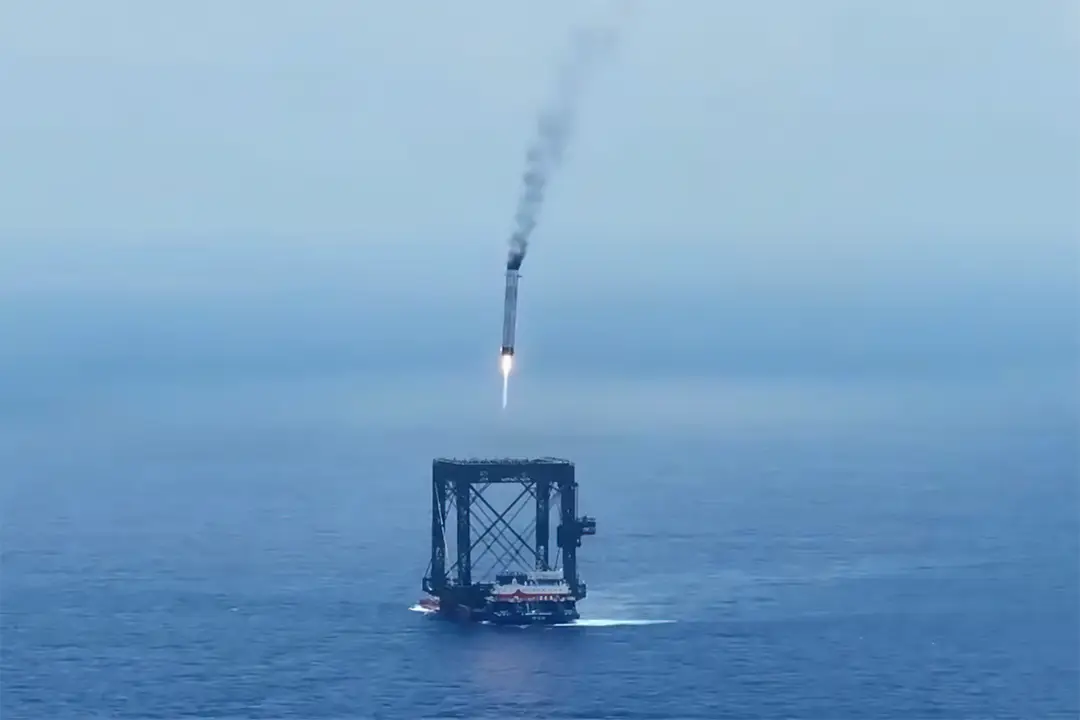 Photograph of the Long March 10B booster landing into a net in the South China Sea