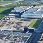 Photograph shows an aerial view of Tesla's Shanghai Gigafactory site