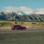 Photograph shows Xiaomi's YU7 SUV driving along a deserted road