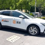 Picture shows a parked Didi Chuxing taxi