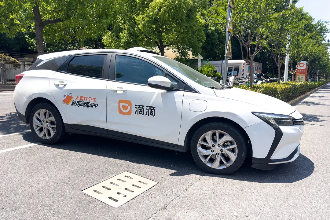 Picture shows a parked Didi Chuxing taxi