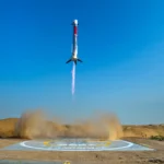 Picture shows LandSpace's reusable Zhuque-3 (Y2) first-stage performing a powered vertical recovery with landing legs at its designated recovery site