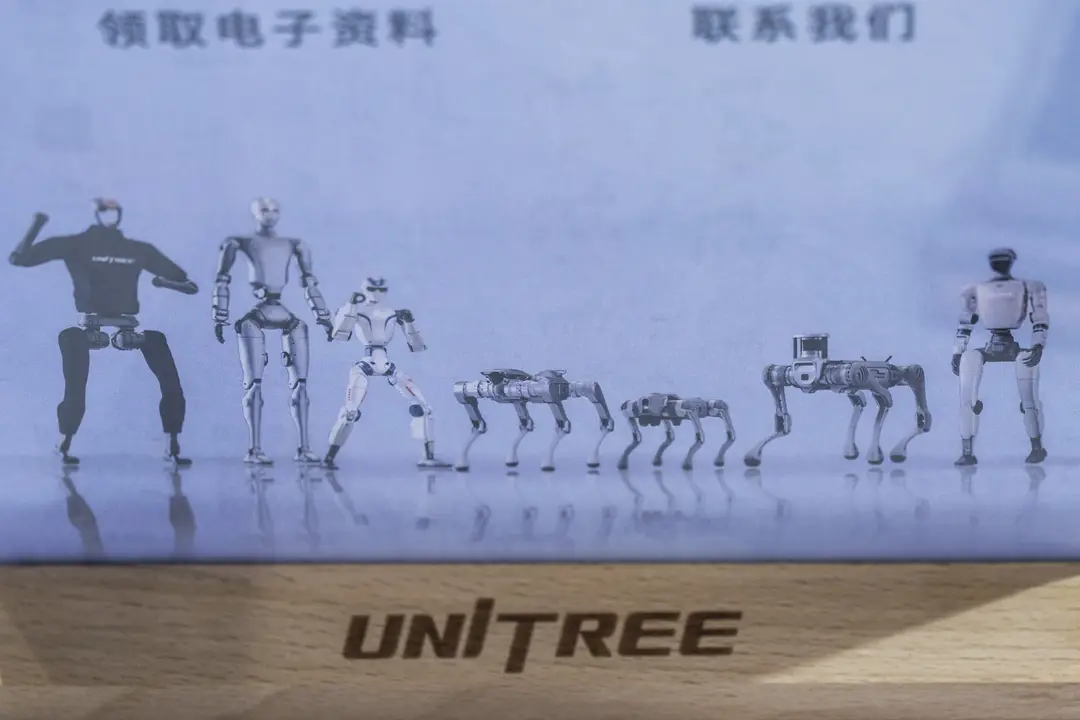 Picture shows Unitree's product lineup on display at the company's booth during the Embodied Intelligent Robot Industry Exhibition in Shanghai, China on Aug. 12.