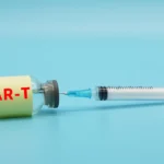Photograph shows a vial of CAR-T with a syringe attached