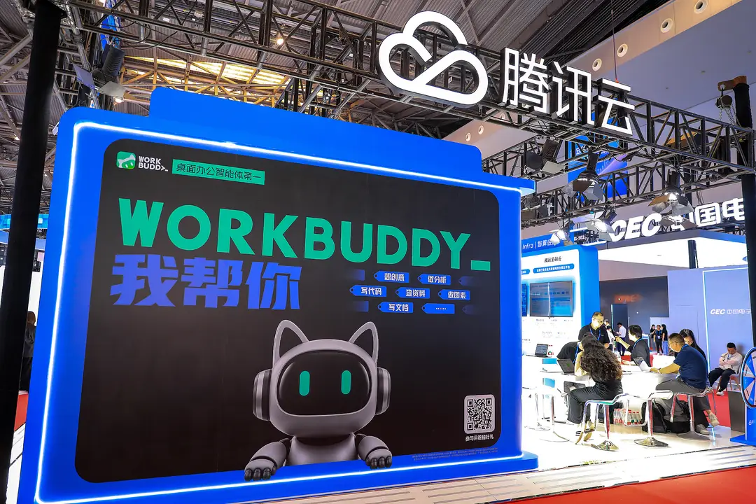 Photograph shows Tencent promoting its WorkBuddy AI agent at an exhibition in Shanghai in June